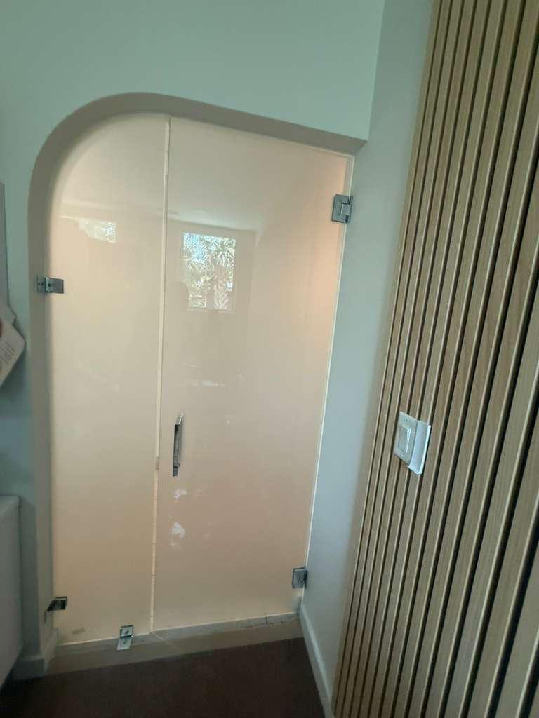 Arched frosted glass door installation