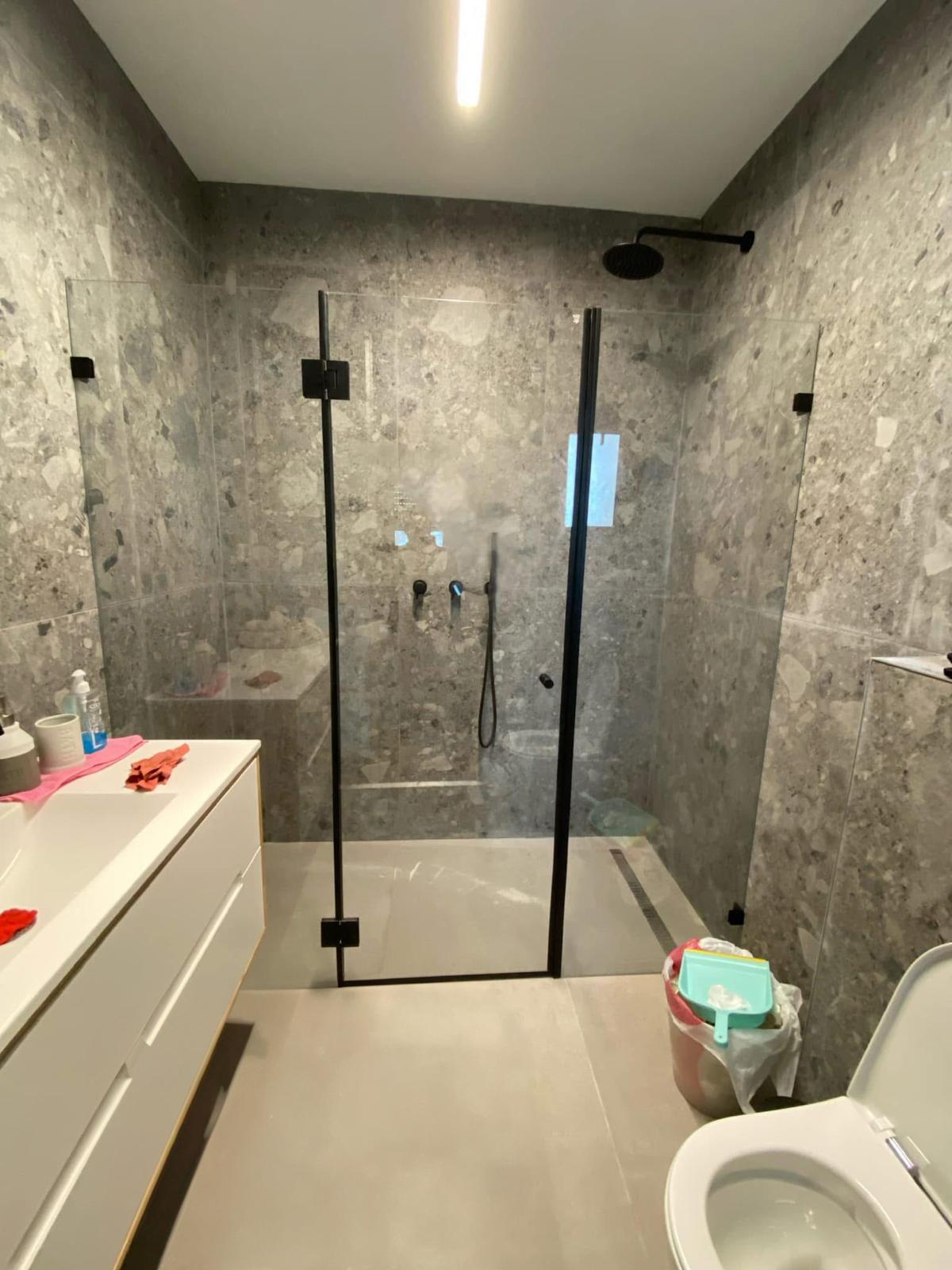 Black framed shower glass enclosure