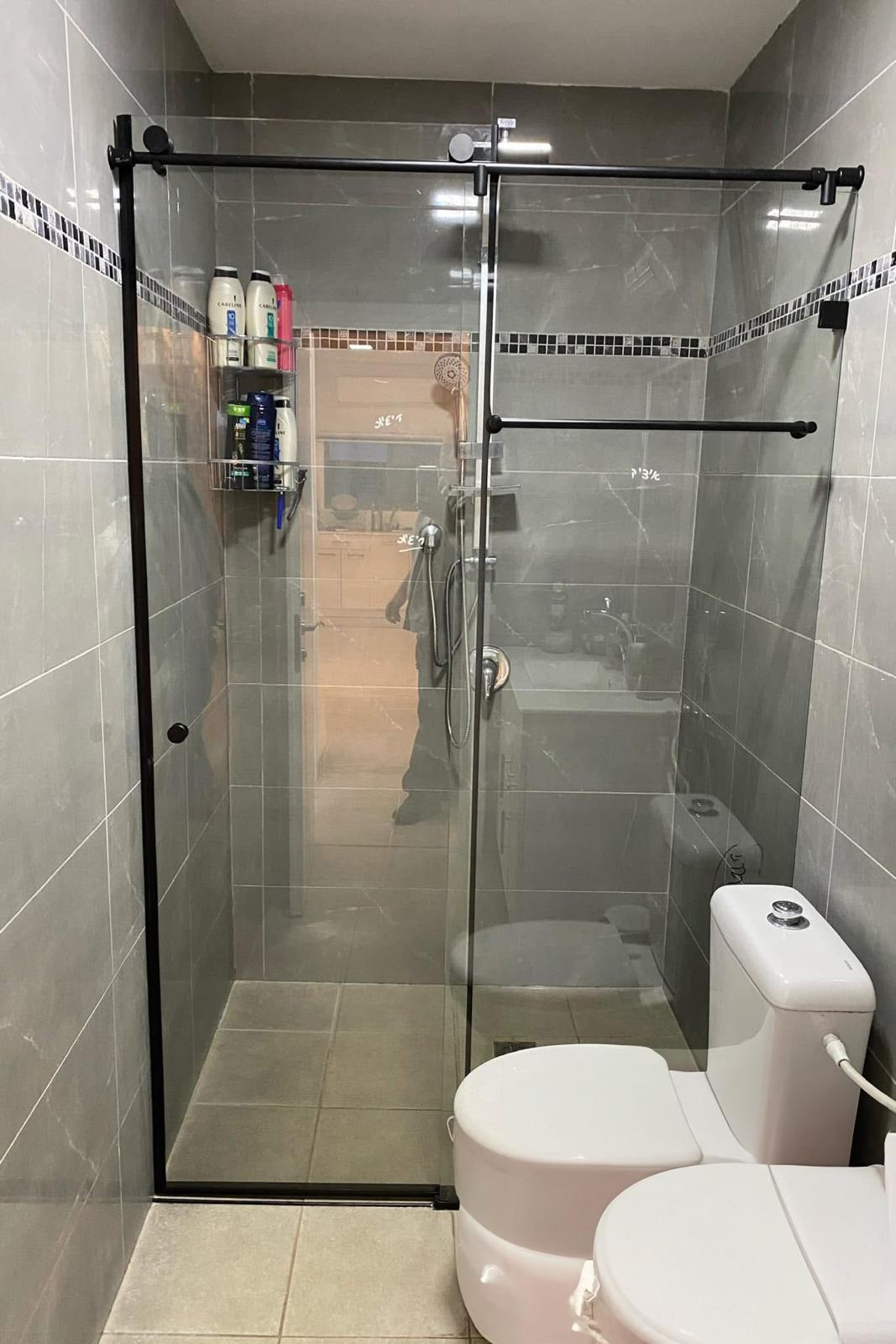 Black framed sliding shower glass doors