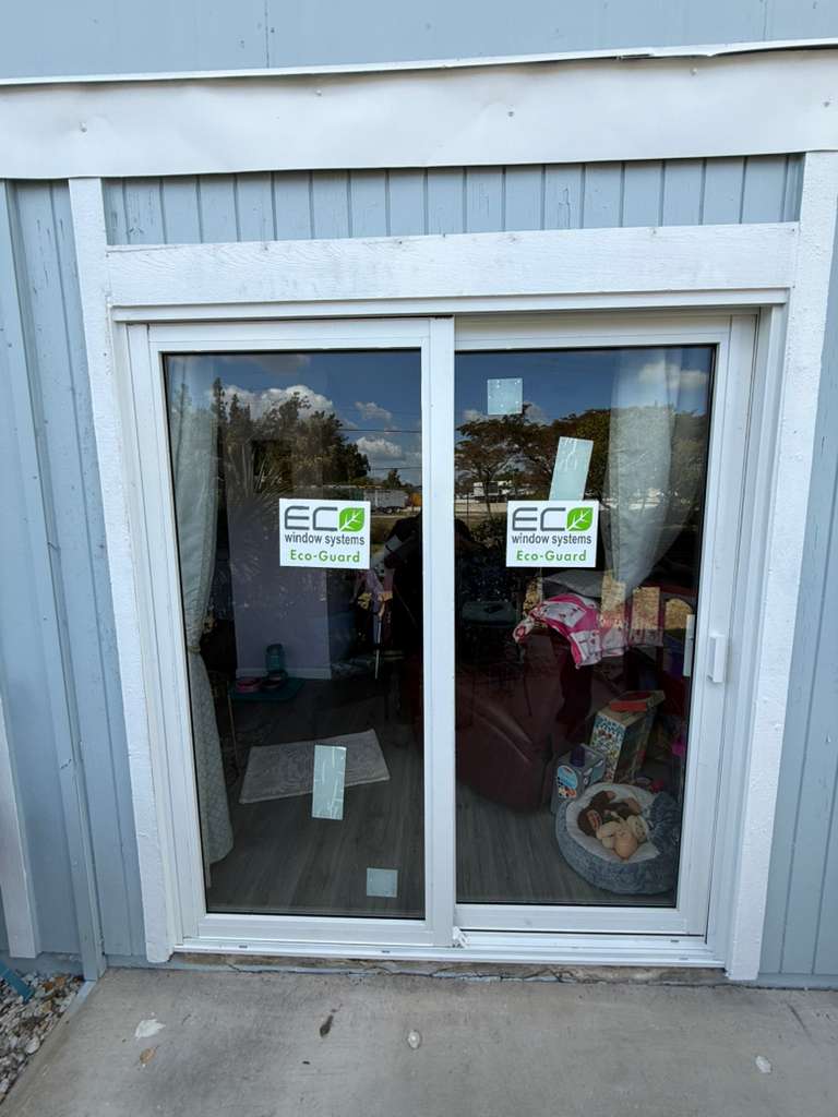 White sliding glass door replacement with new panels