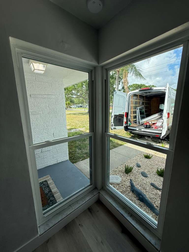White corner window repair with fixed glass panels