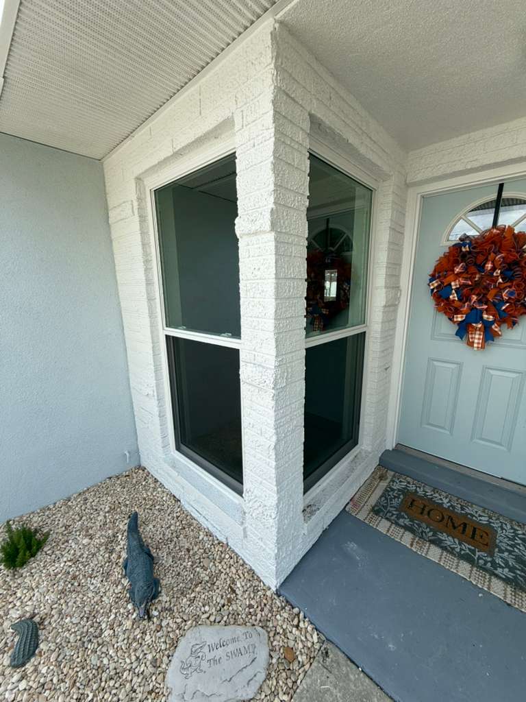 White bay window repair with multiple glass panels